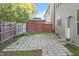 Backyard featuring a stone patio with a wooden fence and vinyl siding at 5417 Razan St, Raleigh, NC 27616