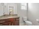 Bathroom with granite countertops, a modern sink, and fixtures with neutral-toned walls at 5417 Razan St, Raleigh, NC 27616