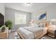 Modern bedroom featuring a cozy bed, neutral tones, and contemporary decor for a relaxing ambiance at 5417 Razan St, Raleigh, NC 27616