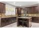 Modern kitchen showcasing stylish dark cabinets, stainless steel appliances, and a functional center island at 5417 Razan St, Raleigh, NC 27616