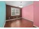 Empty bedroom showcasing hardwood floors, a window, and two-tone wall at 545 Irvan St, Clayton, NC 27520