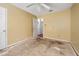 A bedroom featuring a ceiling fan and doorway leading to the hall, ideal for personalization at 545 Irvan St, Clayton, NC 27520