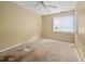 Bedroom with a ceiling fan and window that has blinds, ready for customization and personalization at 545 Irvan St, Clayton, NC 27520