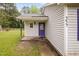 Charming covered front porch with an entry door and classic siding at 545 Irvan St, Clayton, NC 27520