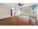 Bright living room with hardwood floors, ceiling fan, and French doors that offer a view of the backyard at 545 Irvan St, Clayton, NC 27520
