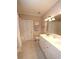 Bathroom with double sink vanity, tile flooring, and shower-tub combo at 5515 S Roxboro St # 16, Durham, NC 27713