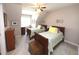 Bright bedroom featuring two twin beds, ceiling fan, and neutral carpeting at 5515 S Roxboro St # 16, Durham, NC 27713