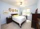 Bright bedroom with a ceiling fan, natural light, and ample closet space at 5515 S Roxboro St # 16, Durham, NC 27713