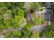Aerial view of home surrounded by trees at 5816 Old Forge Cir, Raleigh, NC 27609