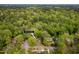 Overhead view of home surrounded by lush trees at 5816 Old Forge Cir, Raleigh, NC 27609