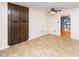Eat-in kitchen with built-in wood cabinetry, view into adjacent living area and neutral color palette at 5816 Old Forge Cir, Raleigh, NC 27609
