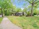 Beautiful home featuring an attached garage, front porch, landscaping, and a lush green lawn at 5816 Old Forge Cir, Raleigh, NC 27609