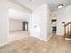 Bright entryway featuring tile flooring, closet, and views of the living area and staircase at 5816 Old Forge Cir, Raleigh, NC 27609