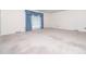 Expansive living room with neutral carpet, large window, and ample natural light at 5816 Old Forge Cir, Raleigh, NC 27609