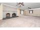 Spacious living room features a brick fireplace and natural light from multiple windows at 5816 Old Forge Cir, Raleigh, NC 27609