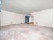 Spacious living room with large windows, neutral walls, and an open layout at 5816 Old Forge Cir, Raleigh, NC 27609
