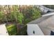 A lush backyard with a privacy fence surrounded by mature trees at 604 Craftsman Ridge Trail, Knightdale, NC 27545