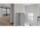 Upstairs hallway with neutral carpet and great natural light at 604 Craftsman Ridge Trail, Knightdale, NC 27545