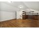 Bonus room featuring hardwood floors, built-in cabinetry, and a staircase, offering flexible space at 604 Mills St, Raleigh, NC 27608