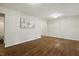 Living room showcasing hardwood floors, neutral walls, recessed lights, and large artwork at 604 Mills St, Raleigh, NC 27608