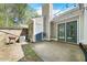 Outdoor patio with string lights and privacy fence at 65 Forest Oaks Dr, Durham, NC 27705