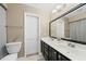 Bathroom featuring double sinks and a decorative mirror at 65 Forest Oaks Dr, Durham, NC 27705