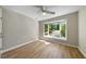 Bright bedroom featuring large windows and hardwood flooring at 65 Forest Oaks Dr, Durham, NC 27705