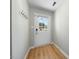 Bright entryway with wood-look floors and coat hooks at 65 Forest Oaks Dr, Durham, NC 27705