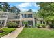 Charming home with manicured front lawn and traditional architectural details at 65 Forest Oaks Dr, Durham, NC 27705
