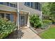Inviting front entrance with well-maintained landscaping and a covered doorway at 65 Forest Oaks Dr, Durham, NC 27705
