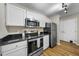Modern kitchen with stainless steel appliances and white cabinets at 65 Forest Oaks Dr, Durham, NC 27705