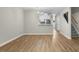 Open concept living room leading to the kitchen and a staircase at 65 Forest Oaks Dr, Durham, NC 27705
