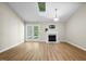 Bright living room with vaulted ceiling, fireplace, and access to the outdoor at 65 Forest Oaks Dr, Durham, NC 27705