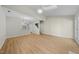 Open concept living room leading to the kitchen and a staircase at 65 Forest Oaks Dr, Durham, NC 27705