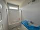 A bathroom featuring a bathtub shower combo, single sink vanity, and neutral color palette at 69 Tee Dr, Selma, NC 27576