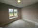 Bedroom with neutral walls, a window, and a standard electrical outlet at 69 Tee Dr, Selma, NC 27576