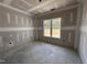 Bedroom featuring a large window with view of the outdoors in a newly constructed room at 69 Tee Dr, Selma, NC 27576