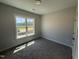 Bedroom featuring carpet, neutral walls and a window overlooking the neighborhood at 69 Tee Dr, Selma, NC 27576