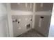 A laundry room showing the connections for a washer and dryer at 69 Tee Dr, Selma, NC 27576