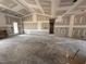 A spacious living room showing an open doorway and natural light through a large glass door at 69 Tee Dr, Selma, NC 27576