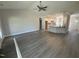 Spacious living room with gray flooring, leading into the kitchen area at 69 Tee Dr, Selma, NC 27576