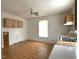 Vintage kitchen featuring wood cabinets, a double sink, and a bright window for natural light at 702 Mill St, Wake Forest, NC 27587