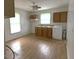 Cozy kitchen with wooden cabinets, a double sink, bright windows, and a vintage design at 702 Mill St, Wake Forest, NC 27587