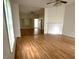 Spacious living room with hardwood floors, a fireplace mantel, and an open layout for entertaining at 702 Mill St, Wake Forest, NC 27587