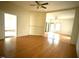 Open-concept living room featuring hardwood floors, high ceilings, and an inviting open space at 702 Mill St, Wake Forest, NC 27587