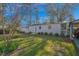 Spacious backyard with a shed, a well-kept lawn, and mature landscaping at 708 W Pope St, Dunn, NC 28334