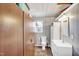 Bathroom with white vanity and wood cabinets at 708 W Pope St, Dunn, NC 28334