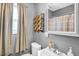 Cozy bathroom with neutral colors featuring a window for natural light, providing a relaxing atmosphere at 708 W Pope St, Dunn, NC 28334