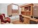 Bedroom features a wood desk with built in bookcase, perfect for studying at 708 W Pope St, Dunn, NC 28334
