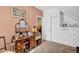 Bedroom featuring vintage vanity, built in drawers, and attic access at 708 W Pope St, Dunn, NC 28334